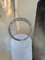 18kw .50ctw E, VS1 Diamond Crescent Tacorie band. Size 7